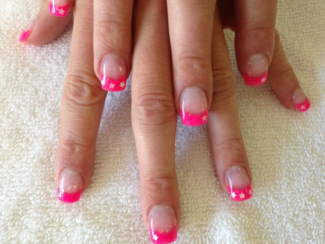 Hot pink French tips with white star accents