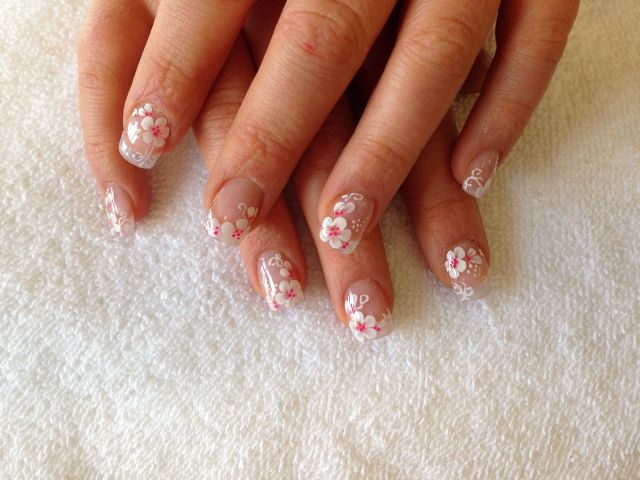 Natural nails with hand-painted white cherry blossoms