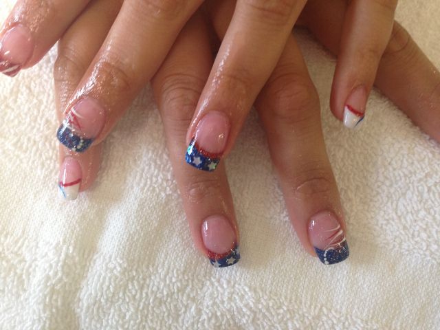 Blue glitter French tips with red and white star accents