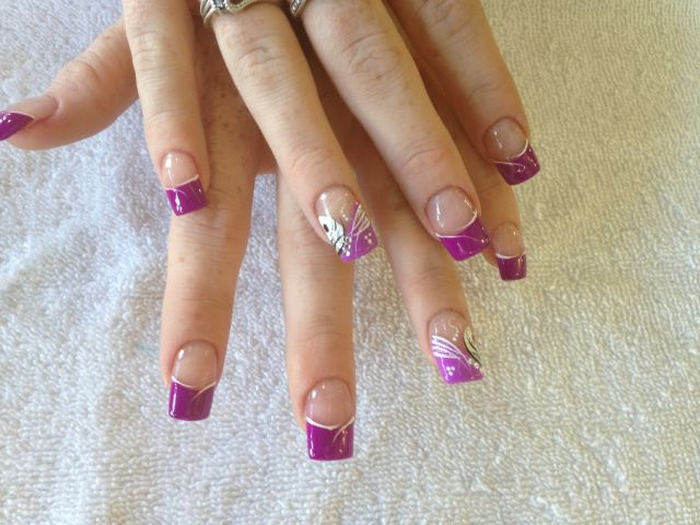 Purple French tips with white swirl and flower accents